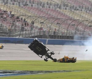 Ryan Briscoe flips after contact with Ryan Hunter-Reay at Auto Club Speedway in Fontana, CA