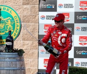 Scott Dixon celebrates his race win and championship title at Sonoma