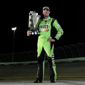 Kyle Busch holds the 2015 NASCAR Cup Series trophy