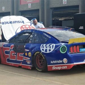 Joey Logano in the Texas Motor Speedway garage with a blown motor. Photo by Beth Lunkenheimer