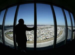 CEO of Speedway Motorsports Inc. Bruton Smith poses for a portrait in his condo overlooking the racetrack during practice for the NASCAR Nextel Cup Series Dickies 500 on November 4, 2005 at Texas Motor Speedway in Ft. Worth, Texas. (Photo by Jonathan Ferrey/Getty Images)