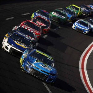 Corey LaJoie, driver of the #7 Raze Energy Chevrolet, leads the field during the NASCAR Cup Series Quaker State 400 at Atlanta Motor Speedway on July 10, 2022 in Hampton, Georgia. (Photo by Jared C. Tilton/Getty Images)