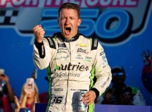 AJ Allmendinger, driver of the #16 Nutrien Ag Solutions Chevrolet, celebrates in victory lane after winning the NASCAR Xfinity Series Drive for the Cure 250 presented by BlueCross BlueShield of North Carolina at Charlotte Motor Speedway on October 08, 2022 in Concord, North Carolina. (Photo by Jared C. Tilton/Getty Images)