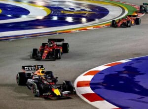 Sergio Perez of Mexico driving the (11) Oracle Red Bull Racing RB18 leads Charles Leclerc of Monaco driving the (16) Ferrari F1-75 during the F1 Grand Prix of Singapore at Marina Bay Street Circuit on October 02, 2022 in Singapore, Singapore. (Photo by Mark Thompson/Getty Images,)