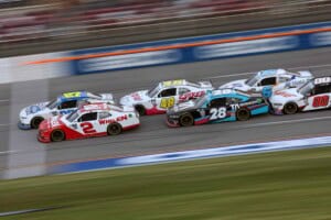 TALLADEGA, ALABAMA - APRIL 22: Jeb Burton, driver of the #27 Solid Rock Carriers Chevrolet, and Sheldon Creed, driver of the #2 Whelen Chevrolet, race during the NASCAR Xfinity Series Ag-Pro 300 at Talladega Superspeedway on April 22, 2023 in Talladega, Alabama. (Photo by James Gilbert/Getty Images)