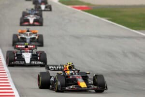 Sergio Perez (No. 11) leads Yuki Tsunoda (No. 22) and others in the 2023 Formula 1 Spanish Grand Prix at the Circuit de Barcelona-Catalunya