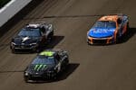 2024 Cup Indianapolis pack racing VII - Todd Gilliland, No. 38 Front Row Motorsports Ford, Ty Gibbs, No. 54 Joe Gibbs Racing Toyota, and Zane Smith, No. 71 Spire Motorsports Chevrolet (Credit: NKP)