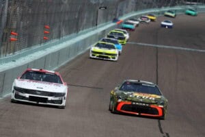 Chase Briscoe, driver of the #19 BassProShopsSpringFishingClassic Toyota, and Josh Berry, driver of the #21 DEX Imaging Ford, race during the NASCAR Cup Series Straight Talk Wireless 400 at Homestead-Miami Speedway on March 23, 2025 in Homestead, Florida. (Photo by Chris Graythen/Getty Images)