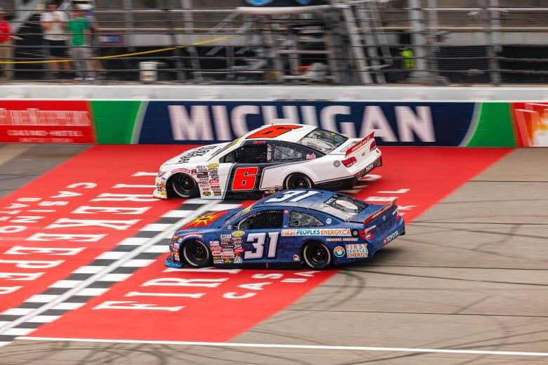 2025 ARCA Michigan side-by-side racing - Lavar Scott, No. 6 Rev Racing Chevrolet, and Derek White, No. 31 Rise Motorsports Toyota (Credit: Zack Silver/ARCA Racing used with permission)