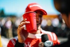 NTT IndyCar Series driver Alex Palou drinks from a Solo cup following his win at Road America.