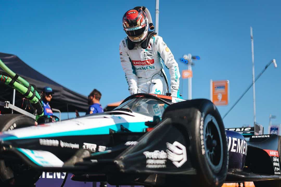 NTT IndyCar Series driver Kyle Kirkwood climbs into his Andretti Global Honda during the 2025 XPEL Grand Prix at Road America.