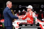 NASCAR President Steve Phelps presents Ty Gibbs, driver of the #54 SAIA LTL Freight Toyota, inaugural In-Season Challenge trophy in victory lane after the NASCAR Cup Series Brickyard 400 Presented by PPG at Indianapolis Motor Speedway on July 27, 2025 in Indianapolis, Indiana. (Photo by James Gilbert/Getty Images)