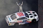 Connor Zilisch celebrates after winning the NASCAR Xfinity Series' Pennzoil 250 at Indianapolis Motor Speedway.