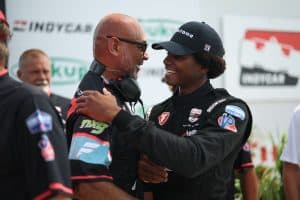 Myles Rowe and Coach Ron Reid embrace after Rowe's victory at Iowa Speedway. Reid owns NXG Youth Motorsports which has been one of Rowe's primary backers.