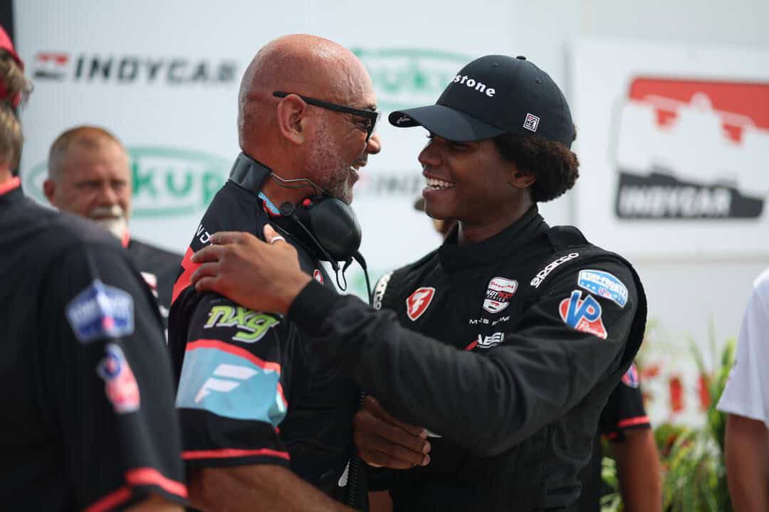Myles Rowe and Coach Ron Reid embrace after Rowe's victory at Iowa Speedway. Reid owns NXG Youth Motorsports which has been one of Rowe's primary backers.