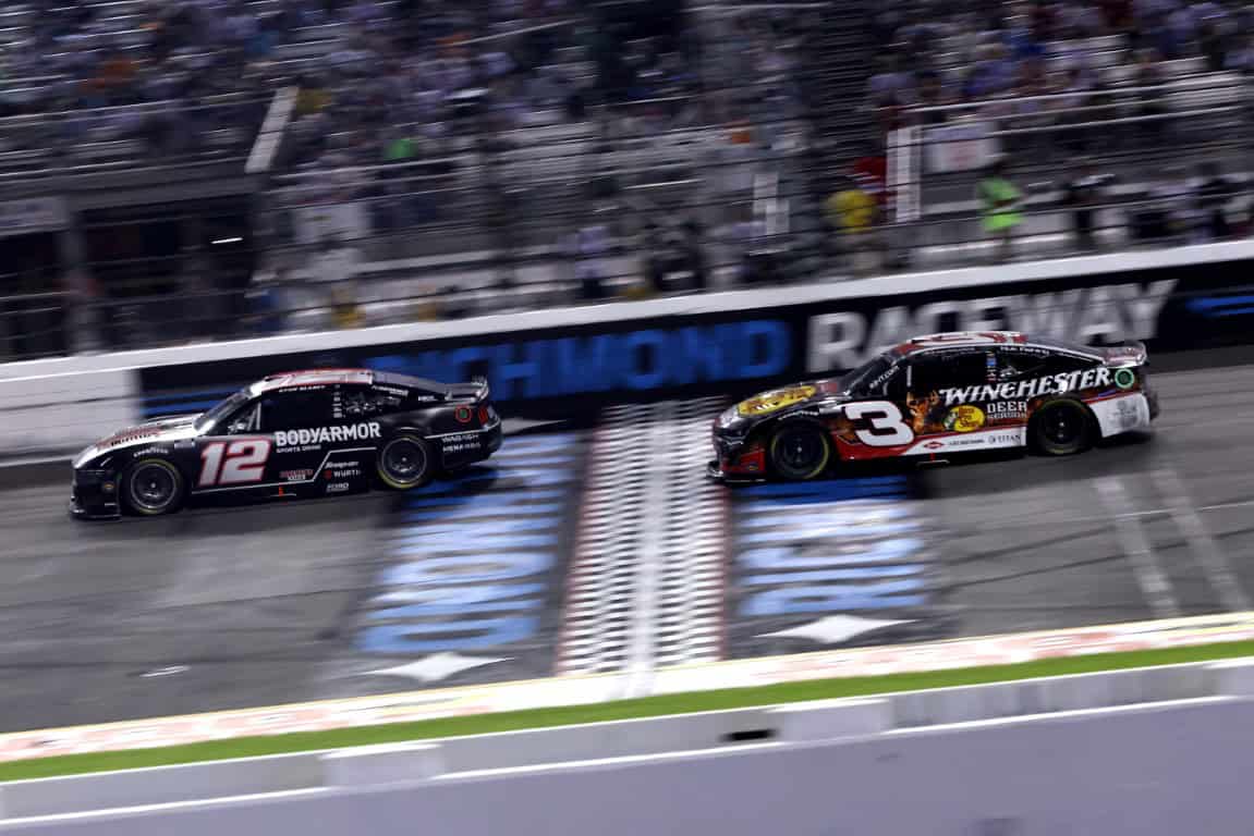 Austin Dillon, driver of the #3 Bass Pro/Winchester Chevrolet, and Ryan Blaney, driver of the #12 BodyArmor Sports Drink Ford, race during the NASCAR Cup Series Cook Out 400 at Richmond Raceway on August 16, 2025 in Richmond, Virginia. (Photo by Samuel Corum/Getty Images)