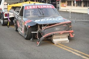 Ben Rhodes' truck is towed to the garage after crashing out of the Mission 176 at the Glen, 8/8/2025 (Photo: Phil Allaway)