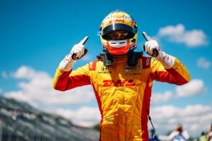 NTT IndyCar Series driver Alex Palou celebrates winning the pole at the Milwaukee Mile.