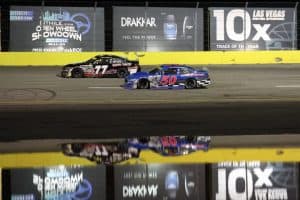 2025 ARCA West Las Vegas bullring side-by-side racing II - Nick Joanides, No. 77 Performance P-1 Motorsports Toyota, and Trevor Huddleston, No. 50 High Point Racing Ford (Credit: Ian Maule/ARCA Racing used with permission)