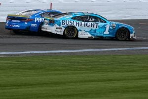 Ross Chastain, driver of the #1 Busch Light Chevrolet, and Denny Hamlin, driver of the #11 Progressive Toyota, spin after an on-track incident to finish the race in reverse the NASCAR Cup Series Bank of America ROVAL 400 at Charlotte Motor Speedway on October 05, 2025 in Concord, North Carolina. (Photo by Jared C. Tilton/Getty Images)