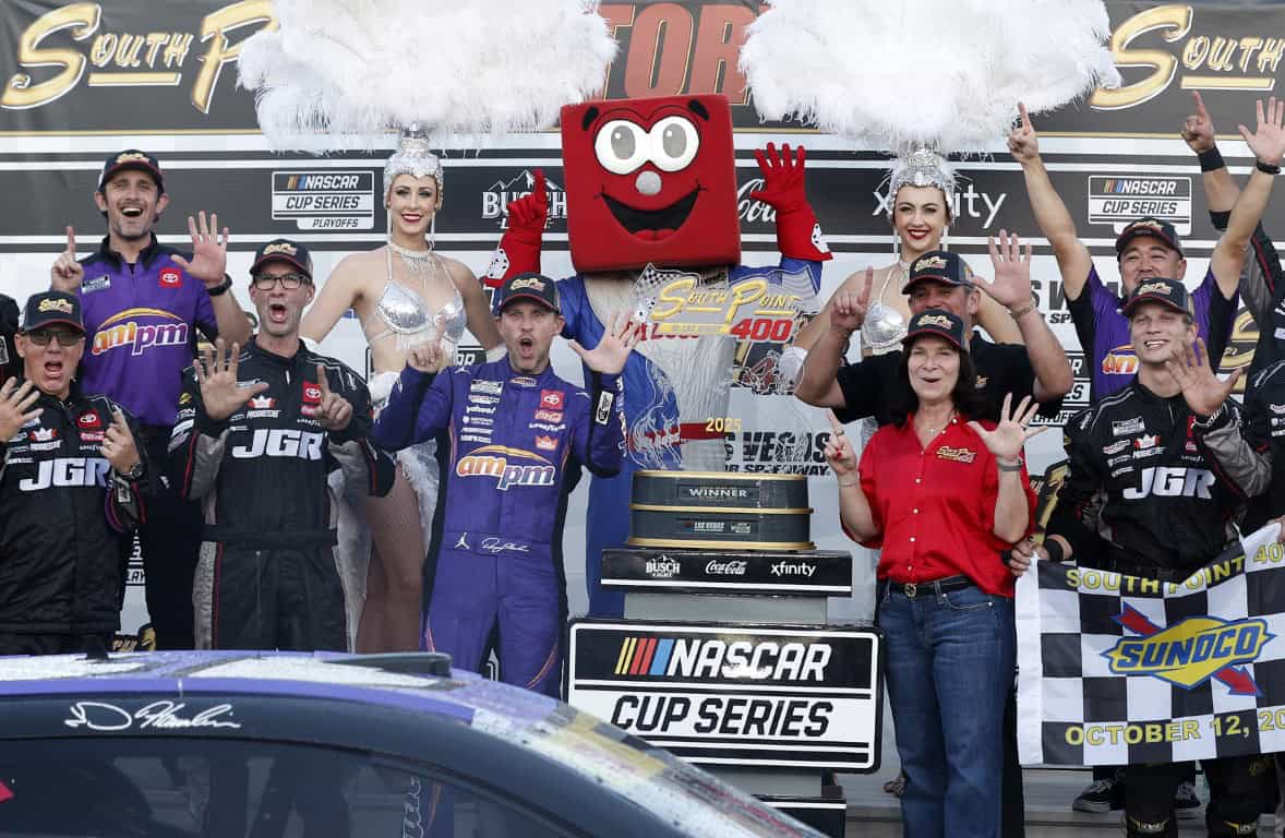 Denny Hamlin, driver of the #11 ampm Toyota, and crew celebrate in victory lane after winning the NASCAR Cup Series South Point 400 at Las Vegas Motor Speedway on October 12, 2025 in Las Vegas, Nevada. (Photo by Logan Riely/Getty Images)