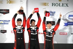 Action Express Racing's Frederik Vesti, Earl Bamber and Jack Aitken celebrate their victory in the Motul Petit Le Mans, 10/11/2025 (Photo: Phil Allaway)