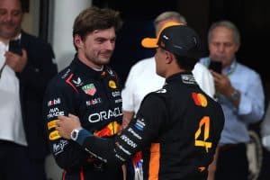 ABU DHABI, UNITED ARAB EMIRATES - DECEMBER 06: Pole position qualifier Max Verstappen of the Netherlands and Oracle Red Bull Racing and Second placed qualifier Lando Norris of Great Britain and McLaren congratulate each other in parc ferme during qualifying ahead of the F1 Grand Prix of Abu Dhabi at Yas Marina Circuit on December 06, 2025 in Abu Dhabi, United Arab Emirates. (Photo by Sam Bloxham/LAT Images) // Getty Images / Red Bull Content Pool // SI202512060471 // Usage for editorial use only //