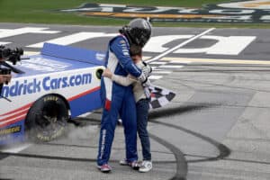 Kyle Busch hugs his son Brexton after winning the NASCAR Craftsman Truck Series race at EchoPark Speedway in Atlanta
