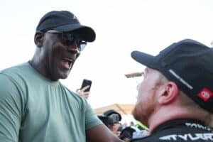Tyler Reddick, driver of the #45 Chumba Casino Toyota, celebrates with Michael Jordan, NBA Hall of Famer and co-owner of 23XI Racing after winning his third race in a row to start the 2026 NASCAR season winning the NASCAR Cup Series DuraMax Grand Prix Powered by RelaDyne at Circuit of The Americas on March 01, 2026 in Austin, Texas. (Photo by James Gilbert/Getty Images