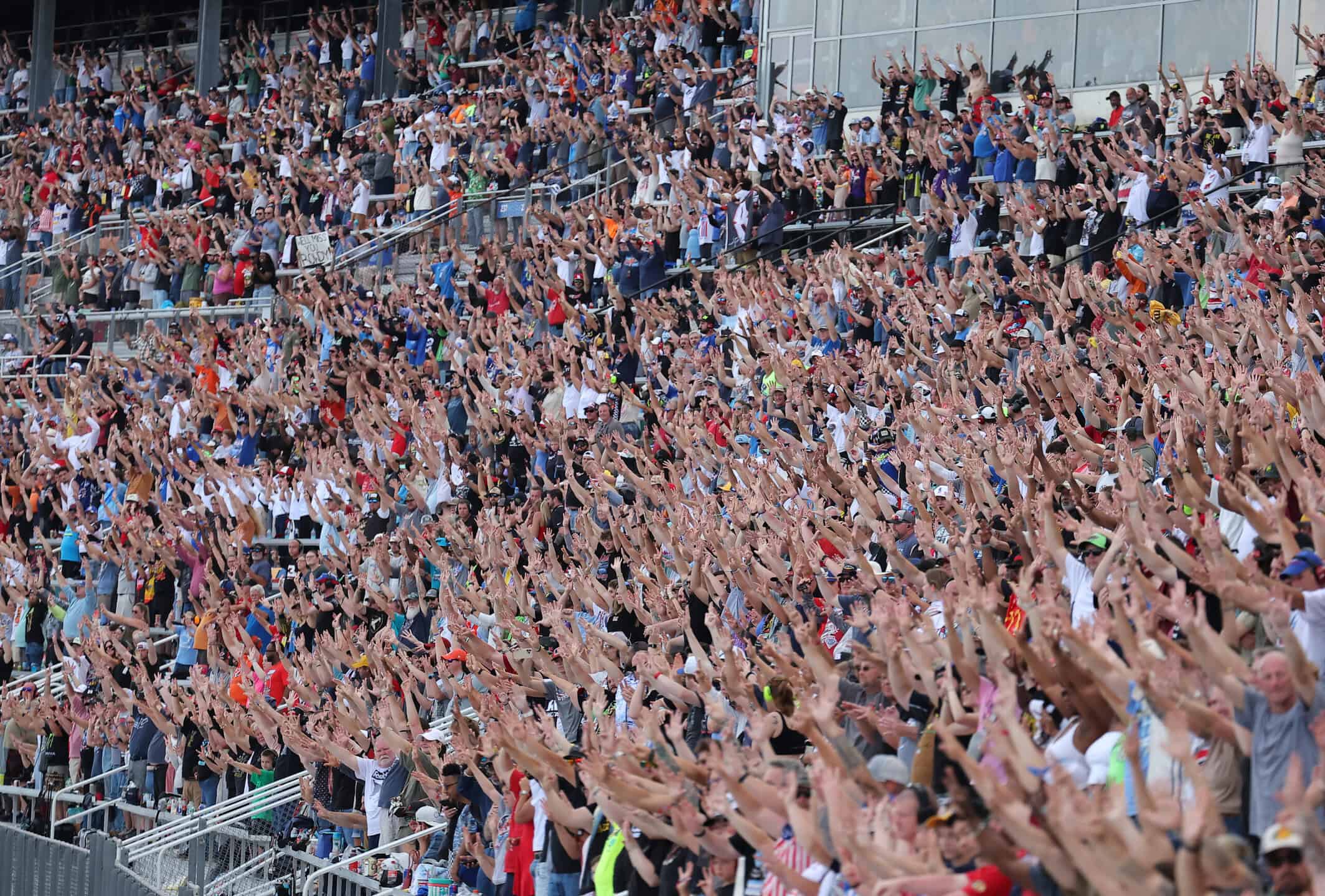 CONCORD, NORTH CAROLINA - MAY 24: A general view of NASCAR fans in the grandstands gesturing the number eight in unison in honor of Kyle Busch, who passed away suddenly at the age of 41, during lap eight of the NASCAR Cup Series Coca-Cola 600 at Charlotte Motor Speedway on May 24, 2026 in Concord, North Carolina.