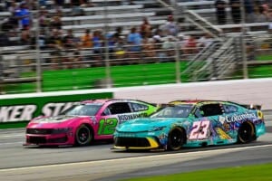 #12: Ryan Blaney, Team Penske, BODYARMOR FLASH I.V. Ford Mustang and #23: Bubba Wallace, 23XI Racing, Columbia PFG/Academy Sports Toyota Camry