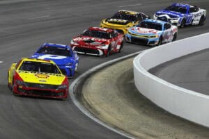 NORTH WILKESBORO, NORTH CAROLINA - JULY 19: Joey Logano, driver of the #22 Shell-Pennzoil Ford, leads the field during the NASCAR Cup Series Window World 450 at North Wilkesboro Speedway on July 19, 2026 in North Wilkesboro, North Carolina.