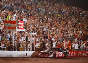 INDIANAPOLIS - JULY 28: Jason Leffler, driver of the #38 Great Clips Toyota, crosses the finishline to win the Kroger 200 at O'Reilly Raceway Park on July 28, 2007 in Indianapolis, Indiana. (Photo by Rusty Jarrett/Getty Images for NASCAR)