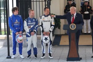 IndyCar drivers stand with President Donald Trump during promotional activities for the Freedom 250 Grand Prix in Washington, D.C.