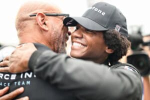 Myles Rowe and Rod Reid embrace after Rowe's victory at the Indy NXT race at World Wide Technology Raceway.