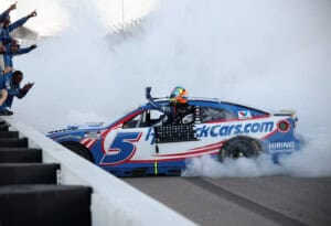 MADISON, ILLINOIS - SEPTEMBER 13: Kyle Larson, driver of the #5 HendrickCars.com Chevrolet, celebrates with his crew after winning the NASCAR Cup Series Enjoy Illinois 300 at WWT Raceway on September 13, 2026 in Madison, Illinois.